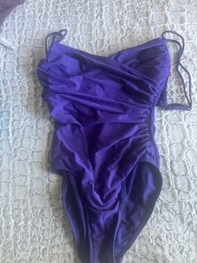 Woman’s Purple Ruched One-Piece Swimsuit.